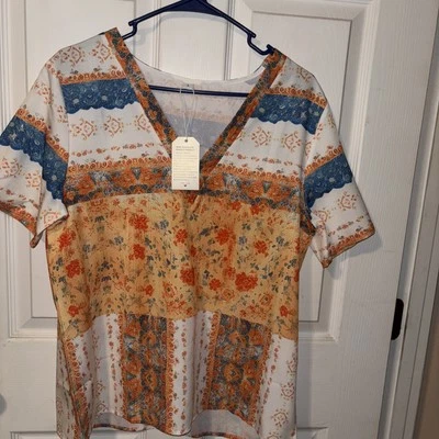 New Woman’s Medical Scrub Top, Lg, Floral Multicolor V-Neck design cotton blend - Image 1 of 4