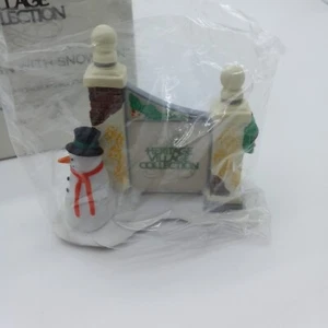 Department 56 #5572-7 Heritage Village Collection - Village Sign with Snowman - Picture 1 of 3