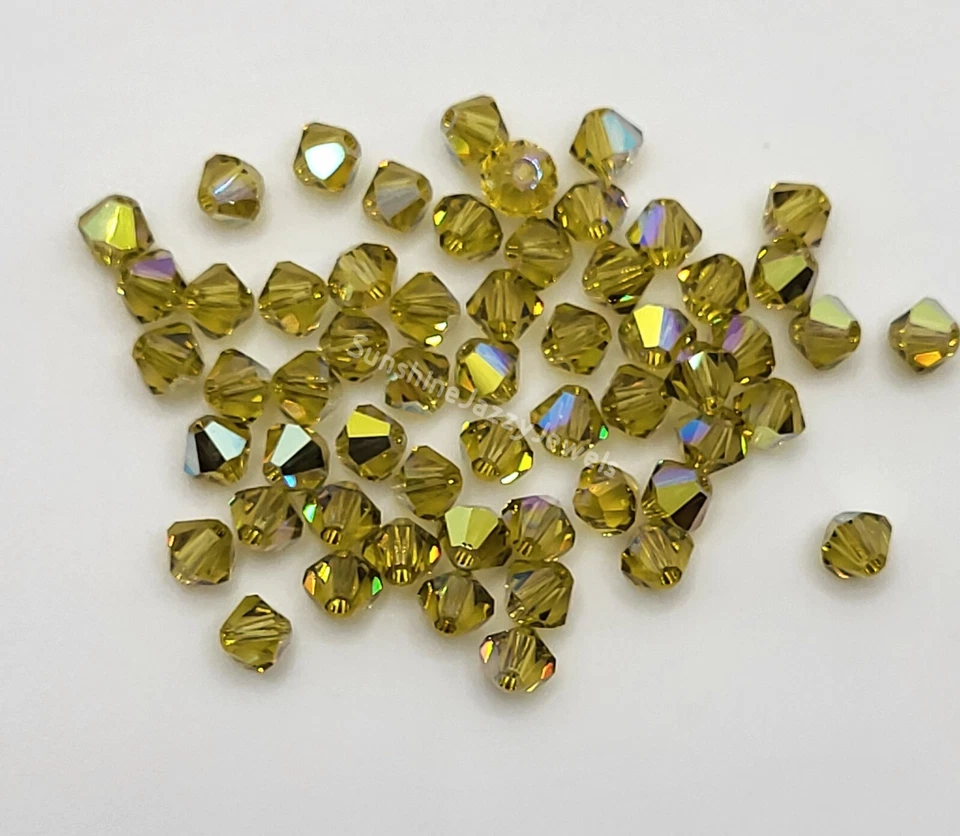 24pc Swarovski Crystal Lime AB 4mm Bicone 5301 Beads; Iridescent - Image 1 of 1