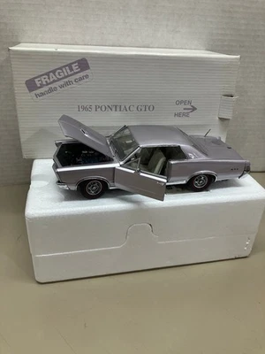 DANBURY COMO NUEVO ESCALA 1/24 1965 PONTIAC GTO COCHE FUNDIDO A PRESIÓN SIN PAPELEO Foto 1 de 4