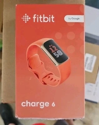 Rastreador de actividad y estado físico Fitbit Charge 6 - dorado/coral Foto 1 de 3