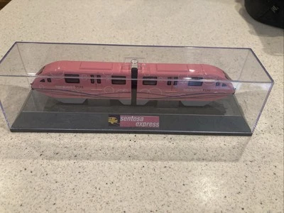 Displayed Singapore Sentosa Diecast Pink Monorail Model - Image 1 of 4