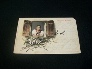 Vintage Postcard- Foreeign Greeting Card-with young woman in window - Picture 1 of 2