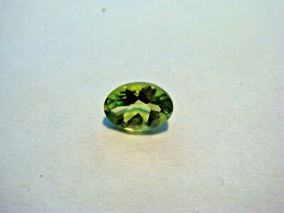Peridot Oval Cut Gemstone 7 mm x 5 mm 1 Carat Natural Gem - Image 1 of 3