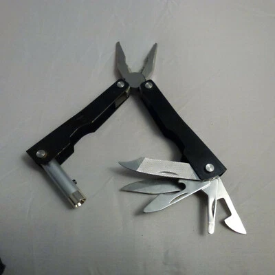 Combination ( leatherman style ) Tool with flash light for Travel or Camping  - Image 1 of 4