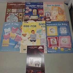 (8) Cross Stitch Leaflets/Books Lot Baby Nursery Bibs Pillow Kids Clowns Animals - Picture 1 of 14