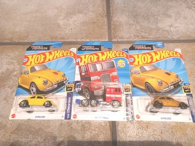 Hot Wheels Transformers Lot of 3 -  Optimus Prime & 2 Bumblebee (Gold/Yellow)  - Image 1 of 4