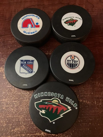 NHL HOCKEY PUCKS (5): WILD (2), OILERS, RANGERS, NORDIQUES Cover