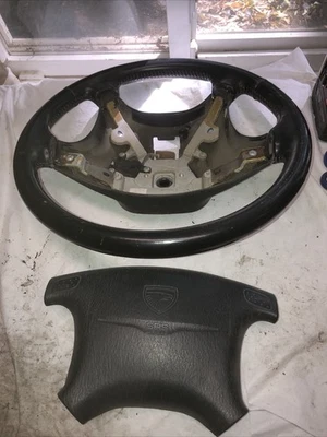 1994-1999 Eagle Talon interior steering wheel emblem black T2 - Image 1 of 4