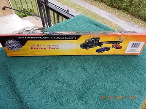 TOY SEMI TRUCK, EXTREME HAULER,FRICTION POWER, FLATBED,WITH 2 RACE CARS - Picture 1 of 11
