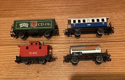 HO Lot of four (4) Marklin HO train cars-Freight, passenger, tanker and caboose - Image 1 of 4
