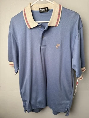 Camisa polo azul Ashworth vintage nueva con etiquetas para hombre L con cuello beige y ribete rojo Foto 1 de 4