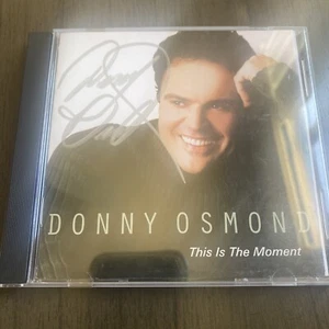 Donny Osmond - Autographed Signed CD This Is The Moment . - Picture 1 of 4