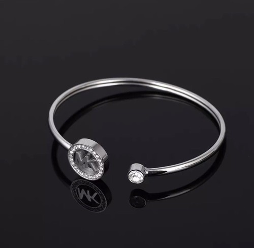 Bracciale logo Michael Kors tono argento nuovo