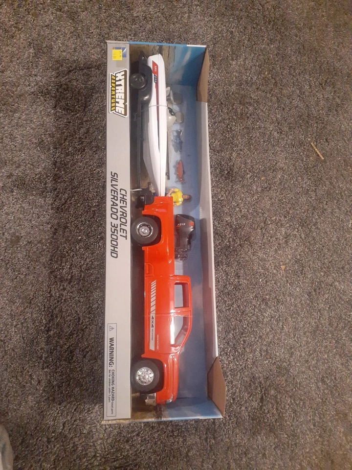NEW IN BOX Chevrolet Silverado 3500HD Trailer , Boat, Motor PLAY SET BY NEW RAY - Image 1 of 1
