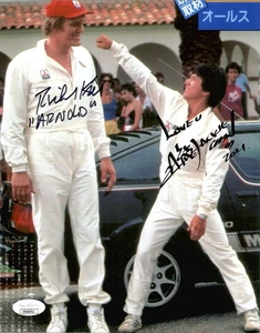 JACKIE CHAN + RICHARD KIEL HANDSIGNIERT 8x10 FARBFOTO KANONENKUGELLAUF JSA - Bild 1 von 1