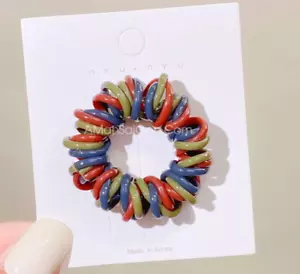 Used Elastic Multi-strand Twisted Plastic Hair Ties - Picture 1 of 5