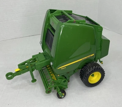 Empacadora redonda de plástico verde/amarillo Ertl Britains escala 1/16 John Deere 854 Foto 1 de 4