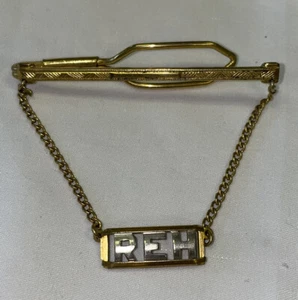 Vintage Goldtone marked NU-LOK Adjustable Tie Bar Clip With Chain Monogram REH - Picture 1 of 7