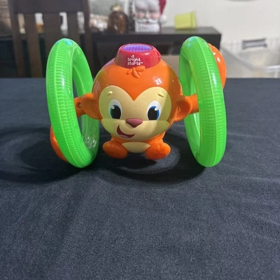 Juguete para bebé gateando mono con luces y sonidos Bright Starts Roll & Glow Foto 1 de 4