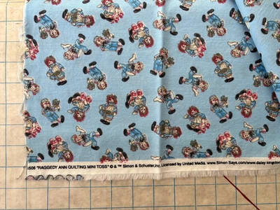 Raggedy Ann Andy Mini Toss Blue Multi Cotton Fabric Simon & Schuster 1.25 Yards - Image 1 of 3