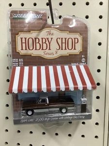 1:64 Greenlight 1984 GMC 2500 High Sierra w/ vintage gas pump - Picture 1 of 1
