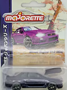 Modellino auto Nissan Skyline GT-R (BNR34) viola notte - Majorette (1/64) - Foto 1 di 3