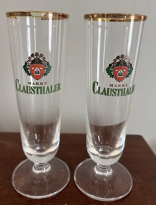 Dos vasos Pilsner con patas de borde dorado de cerveza alemana Clausthaler de 7" de alto... - Imagen 1 de 11