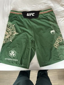 Men's Adrenaline by VENUM Green Noche UFC Authentic Fight Night Long Fit Shorts - Picture 1 of 4