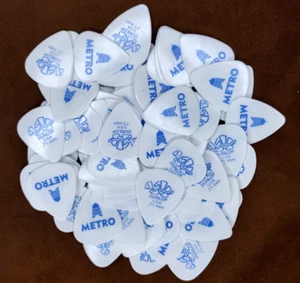 Confezione 100 Plettri Chitarra Vintage Anni 80 Jim Dunlop Souvenir CapMETRO Austin Tortex .71mm - Foto 1 di 5
