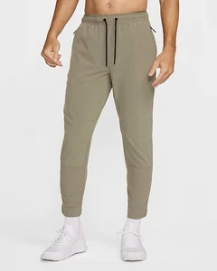 Size Large - Nike Unlimited Dri-FIT Zip Cuff Versatile Black Green Trousers Mens - Picture 1 of 12