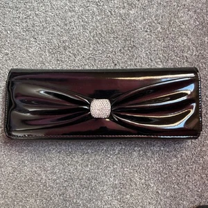 Koko PVC Patent Clutch Bag With Bow Detail To Front - Picture 1 of 21