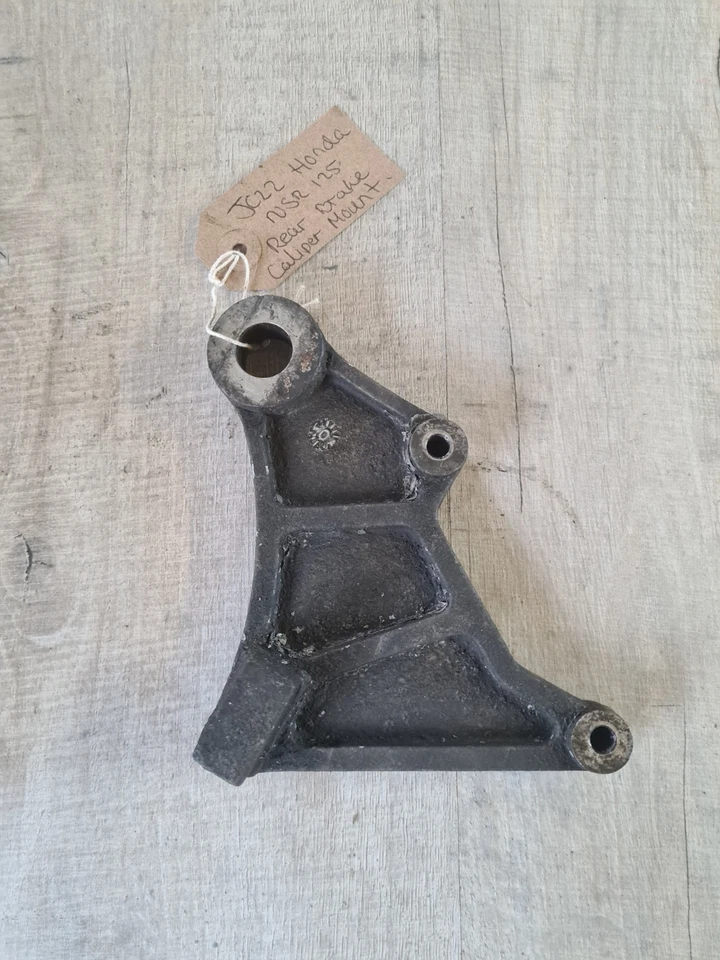 Placa de montaje de soporte de pinza de freno trasero Honda NSR125 NSR 125 JC22 Foto 1 de 4