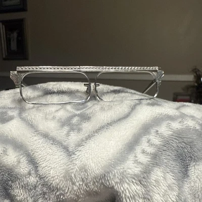 Monturas de gafas retráctiles Tiny Tura vintage de metal plateado sin lentes Foto 1 de 4