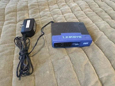 Conmutador de grupo de trabajo Cisco Linksys 5 puertos 10/100 EZXS55W Foto 1 de 4