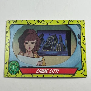 1989 Topps TMNT Teenage Mutant Ninja Turtles #2 Crime City April O'Neil - Imagen 1 de 2