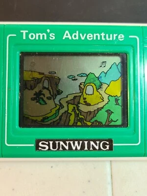 TOM'S ADEVENTURE SUNWING ЖК-игра и часы Протестировано работает звучит отлично. Портативный - Изображение 1 из 4