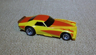 Coche Ranura Vintage AFX Aurora HO Pontiac Grand AM Amarillo y Rojo Foto 1 de 4