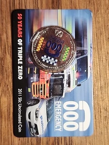 AUSTRALIAN: 2011 50 CENT 50 YEARS OF TRIPLE ZERO 000 COIN ON CARD - Foto 1 di 4