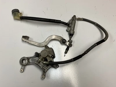 97-99 CR250R CR250 1997 OEM pinza de freno trasera soporte cilindro maestro manguera Foto 1 de 4