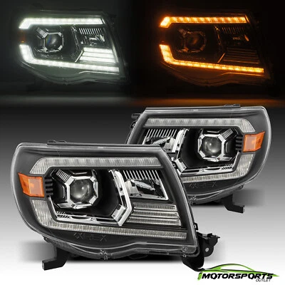For 2005-2011 Toyota Tacoma PRO-Series Halogen Projector Black Headlights Pair - Image 1 of 4