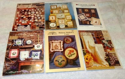 VTG MIXED LOT OF CROSS STITCH LEAFLETS COUNTRY DESIGNS RUSTIC AFGHANS COWS CAT - Image 1 of 4
