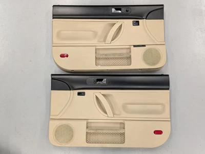 98-10 VW VOLKSWAGEN OEM BEETLE BEIGE TAN / BLACK DRIVER & PASSENGER DOOR PANELS - Image 1 of 4