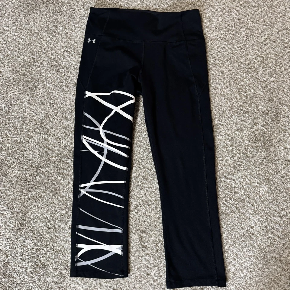 Leggings Under Armour para mujer medianos negros HeatGear ajustados reflectantes ropa deportiva Foto 1 de 4