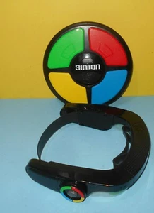 Hasbro Classic Simon Game 2015 Handheld Memory Game w/ Wearable Simon Optix - Picture 1 of 2