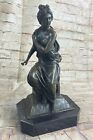  Artnet A French bronze figure depicting a Victorian lady in a Sitting Position