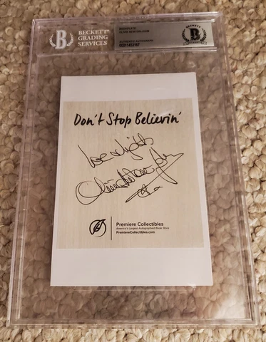 OLIVIA NEWTON-JOHN SIGNED BOOKPLATE ENCAPSULATED BECKETT BAS Cover