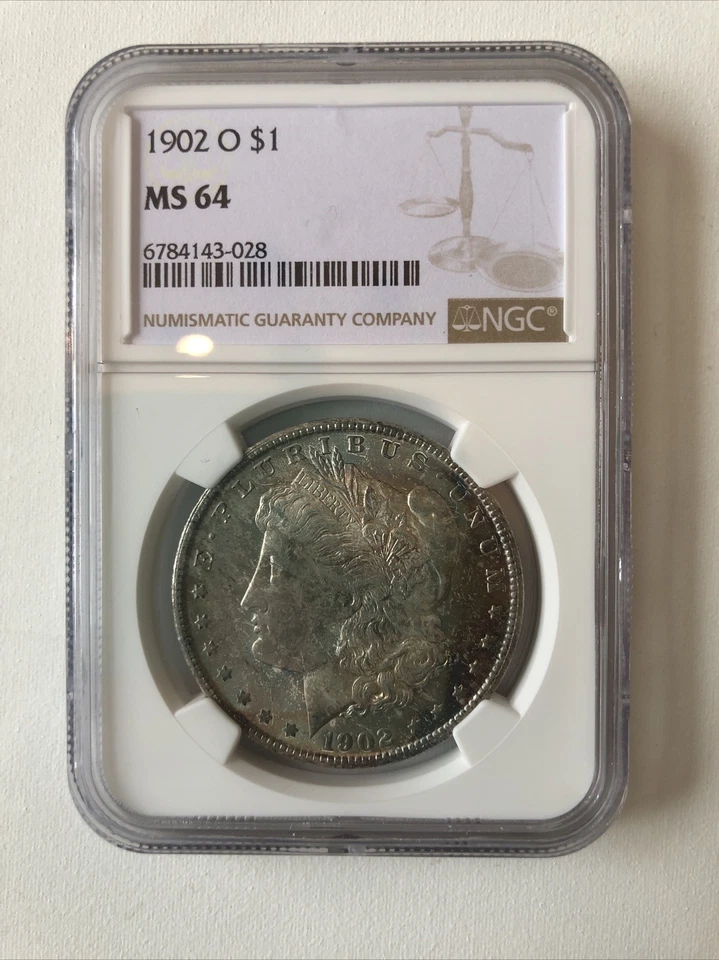 United States 1902 Silver Morgan Dollar Coin Toned NGC MS 64 - Image 1 of 4