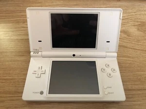Nintendo DSi console + games - Picture 1 of 4
