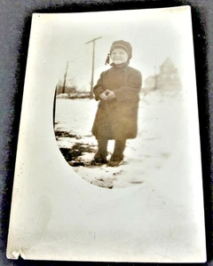 Young Girl standing on the ground in Snowy Winter - RPPC - AZO (1904-1918).  - Picture 1 of 3